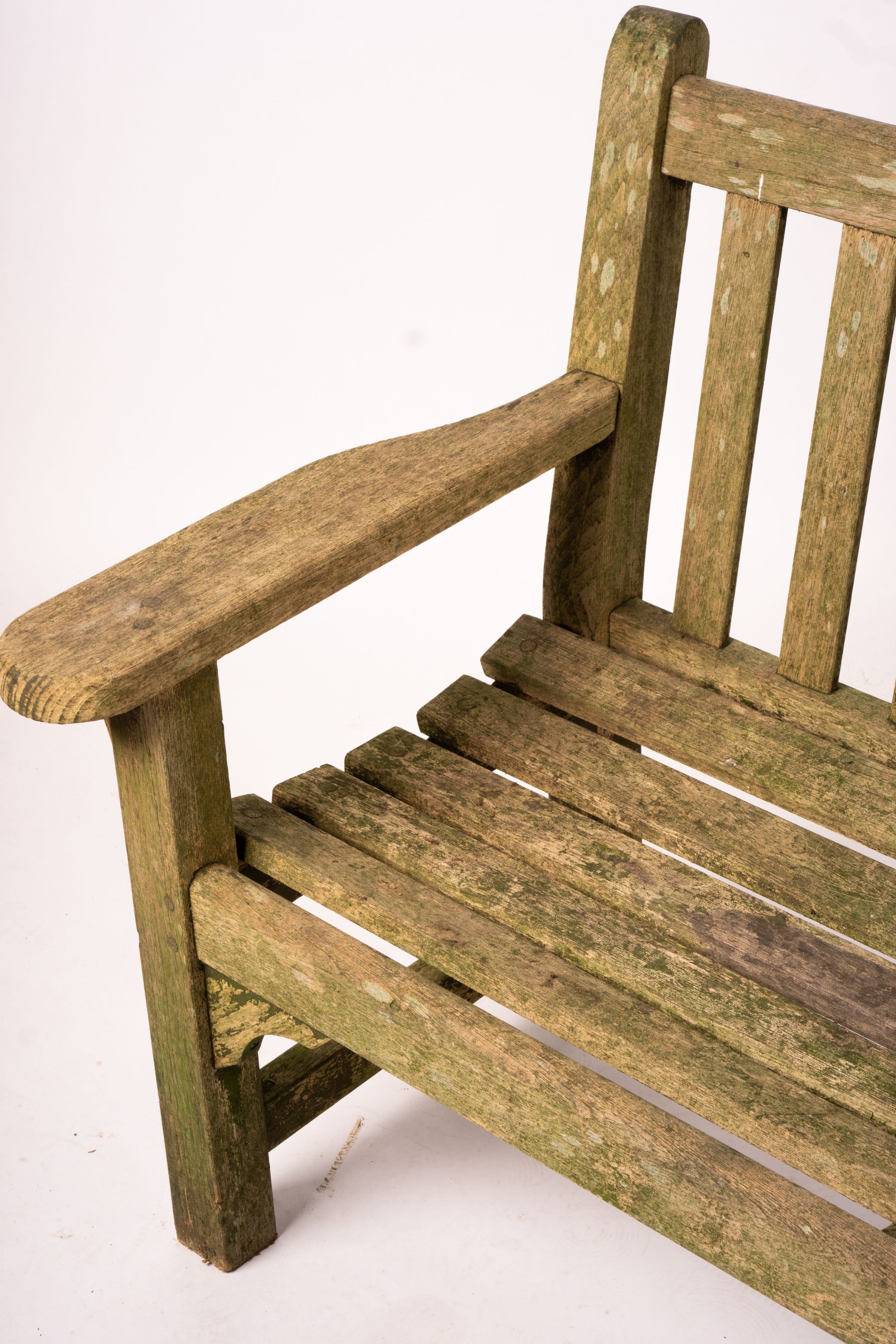 A weathered teak garden bench, length 192cm, width 60cm, height 85cm